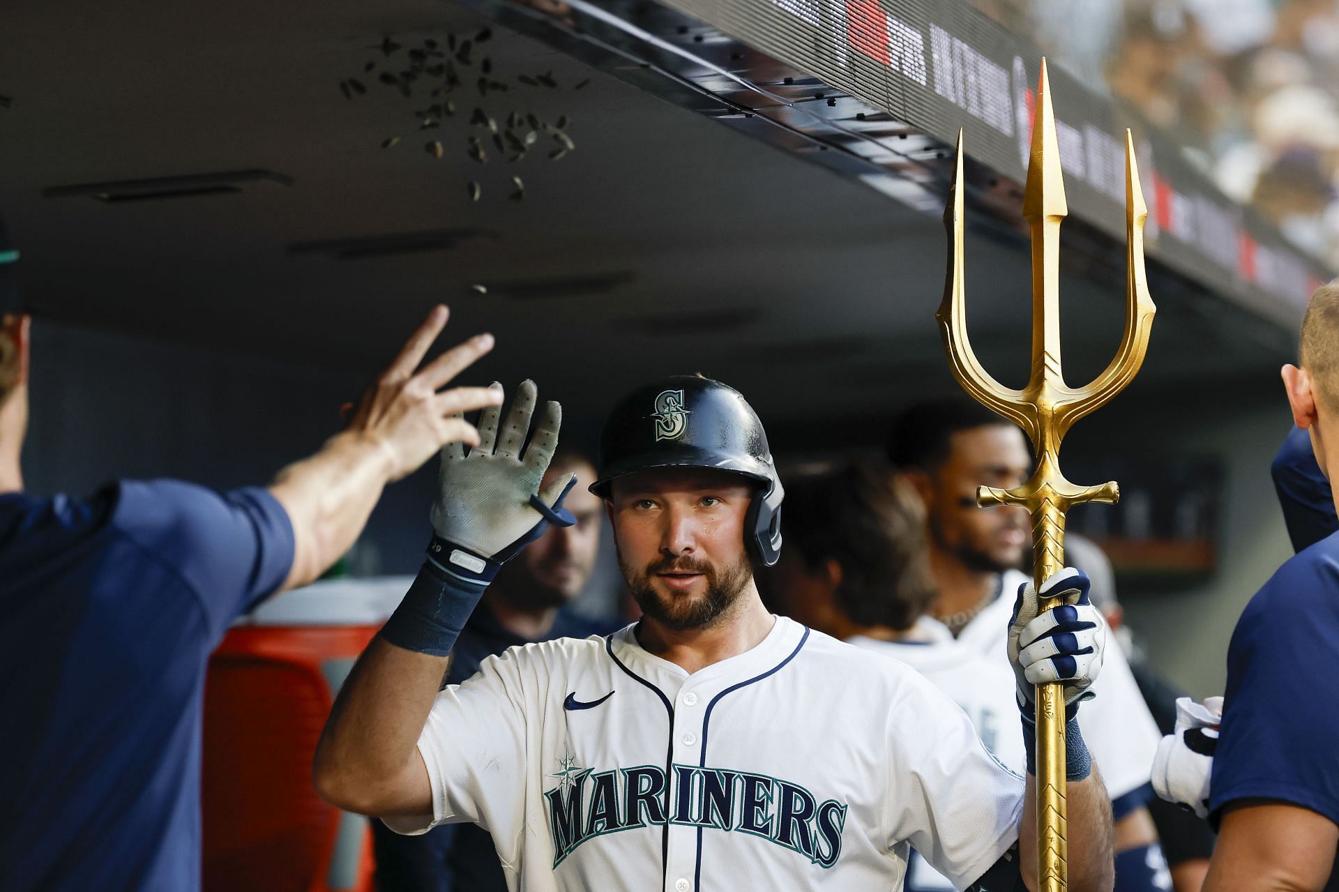 Cal Raleigh celebrates in the dugout after hitting a home run against the Kansas City Royals - Source: Getty